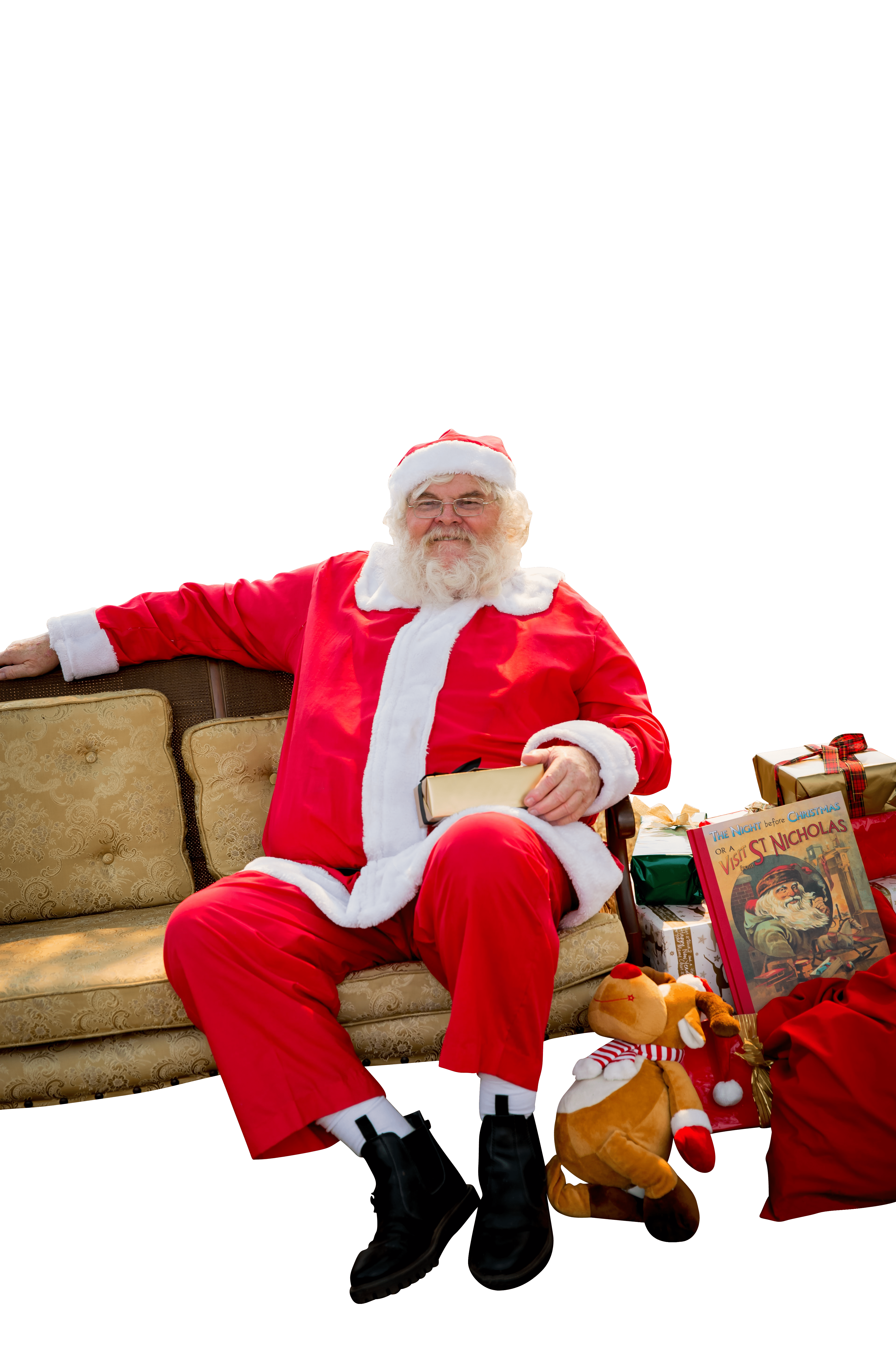 Santa sitting on sofa transparent background.png